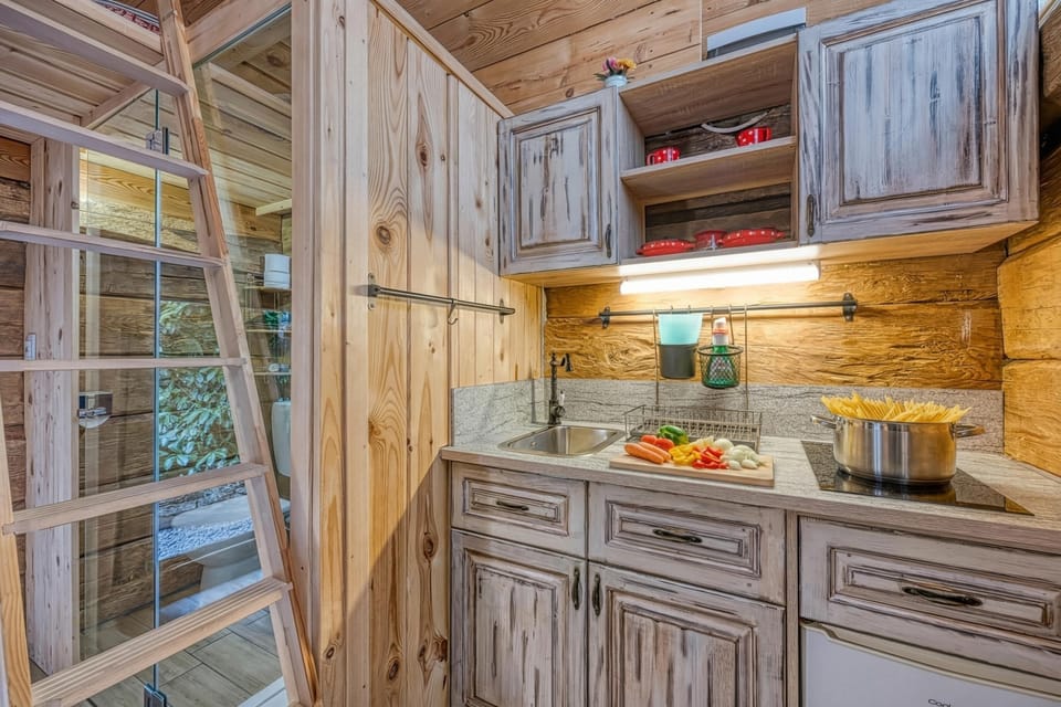 Family House, Multiple Bedrooms (Tiny-Mini Bertl With Hot Tub) | Private kitchenette | Fridge, stovetop, electric kettle, cookware/dishes/utensils