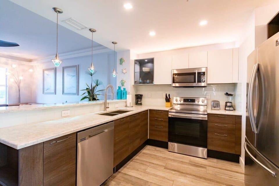 Modern kitchen with stainless steel appliances and a spacious countertop.