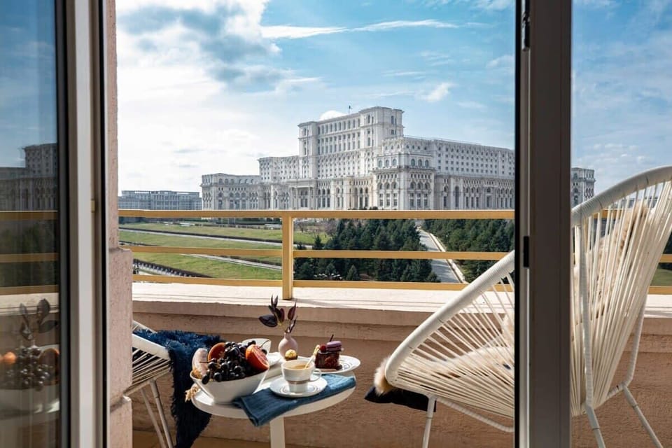 Behold the breathtaking Palace of the Parliament from our balcony, a view that inspires awe.