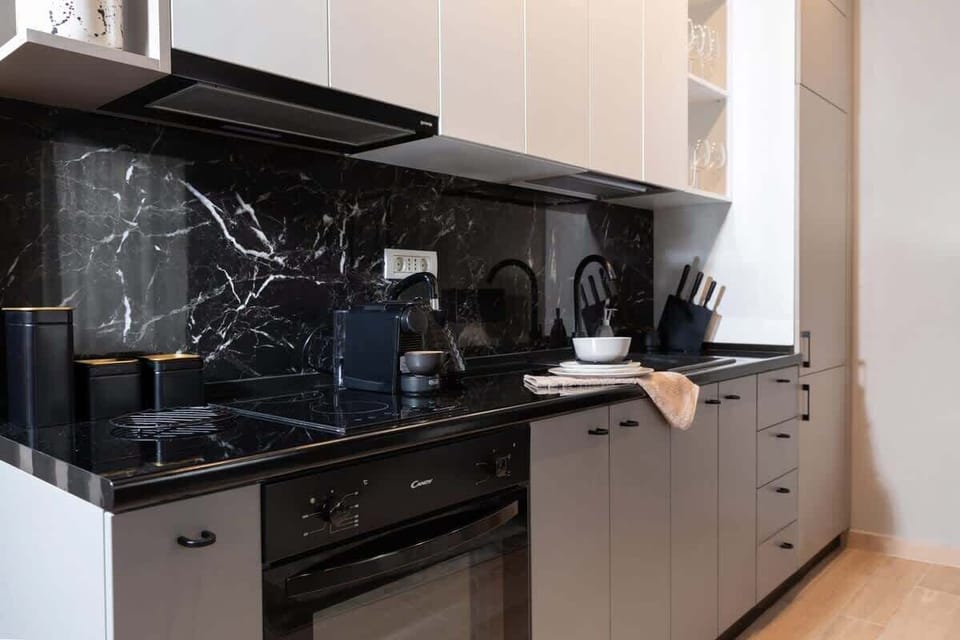 Explore the seamless integration of form and function as you prepare gourmet meals amidst the sleek surfaces and state-of-the-art appliances.