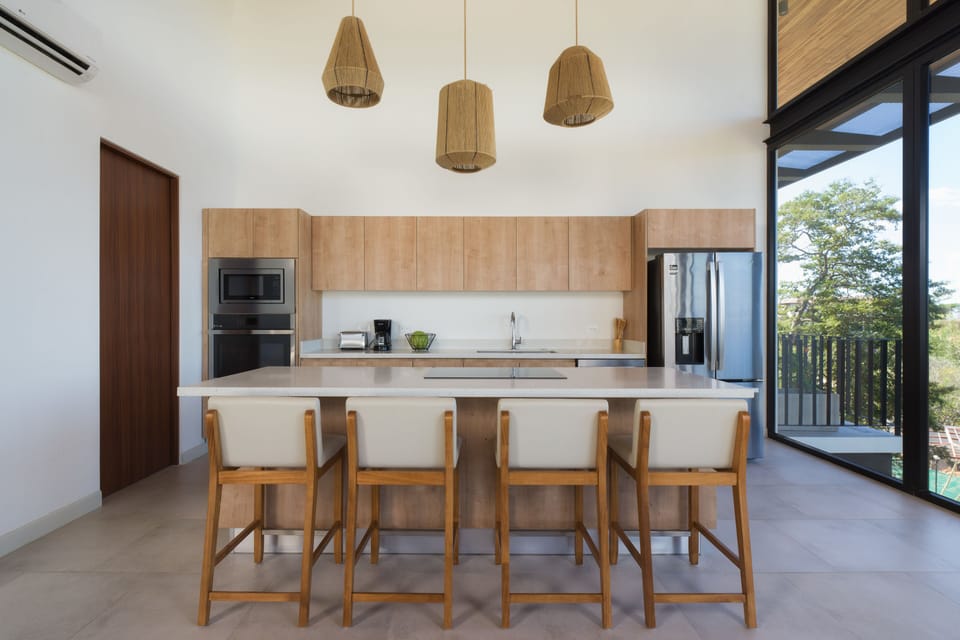 Bright kitchen and dining area with natural lighting - Book a private chef and create special memories