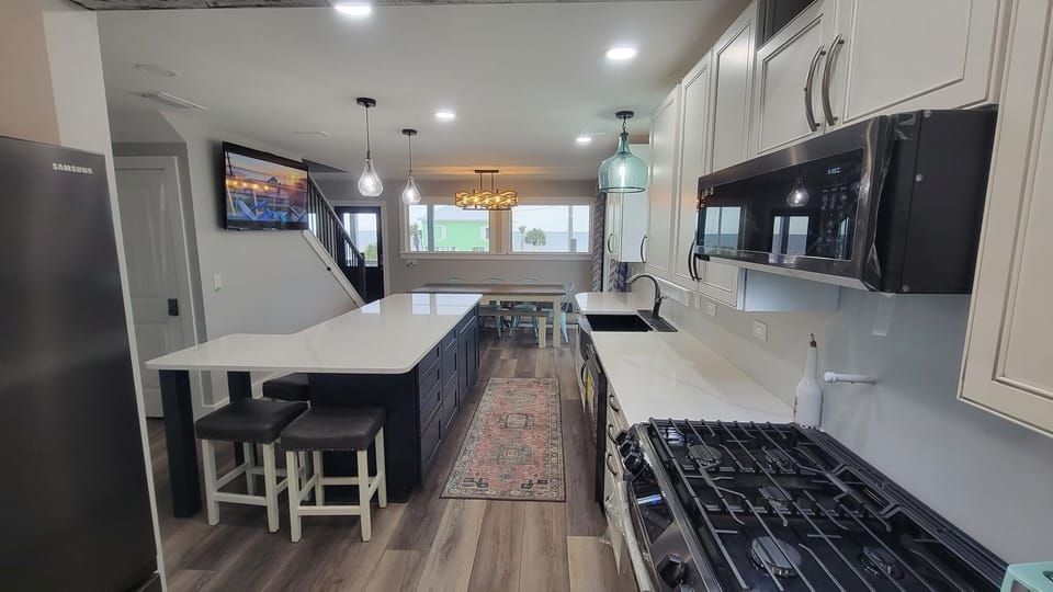 View from the back of the kitchen, you can see the family room and the large picture windows for your ocean view
