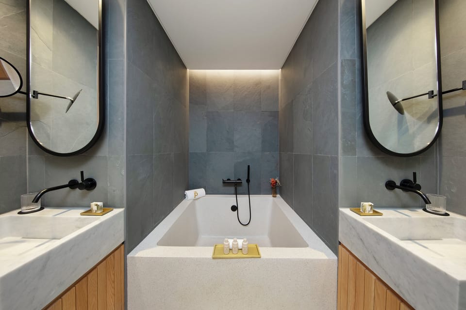 Designer toiletries, hair dryer, bathrobes, slippers
