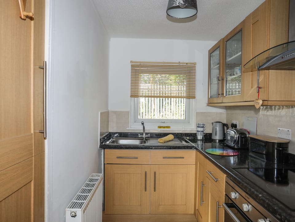 Fridge, electric kettle, toaster, cookware/dishes/utensils
