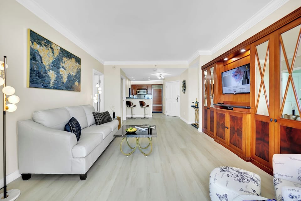 Escape ordinary condos and embrace modern luxury with high-end furniture, wood plank vinyl flooring, and a sleek design throughout.
