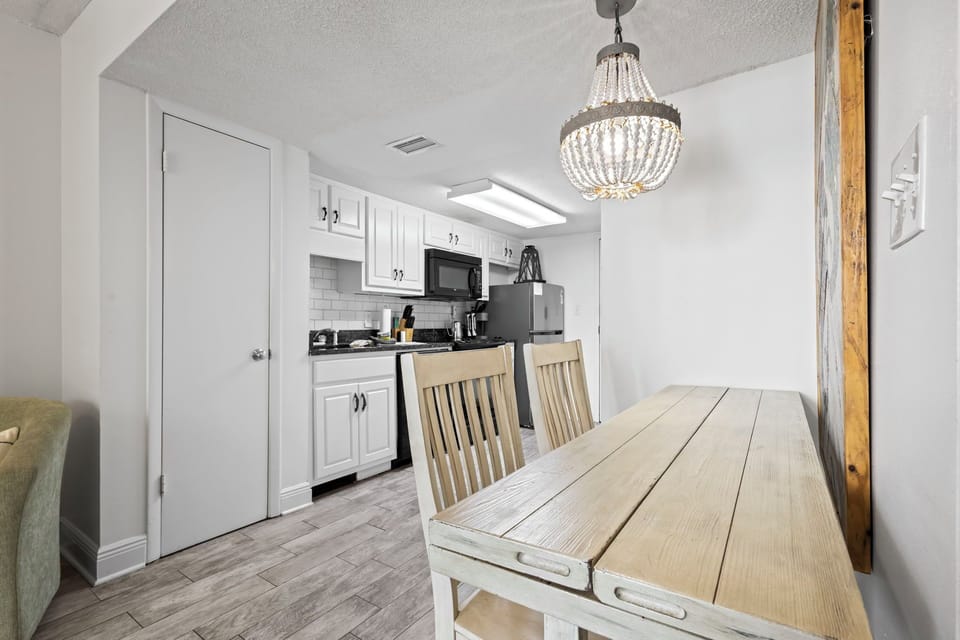 Versatile dining table seats 4, plus a highchair—perfect for meals/work/games!