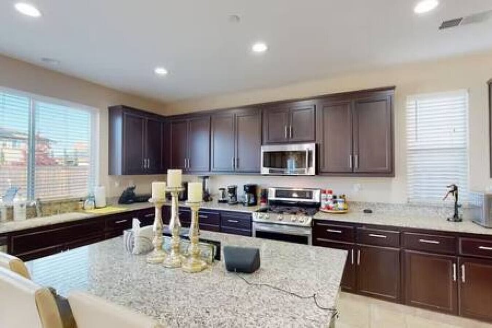 Modern kitchen with granite counters and stainless appliances