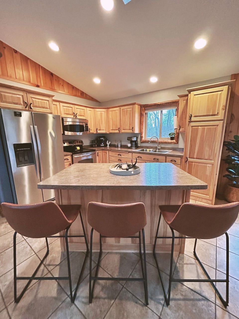 Joyful chatter, shared tasks—cooking dinner around the kitchen island.