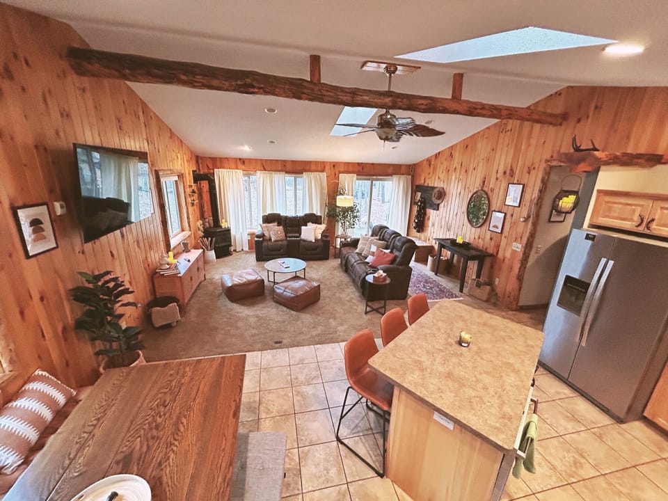 Expansive, interconnected spaces—comfy open-concept cabin living.