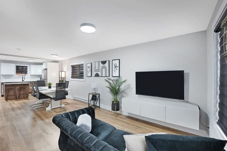 `Stay connected & entertained in our modern family room. Enjoy hi-speed internet & Ethernet for seamless work or play. Binge on your favorite shows & movies with the Smart TV, featuring Netflix, Prime & local Bell TV. Relax & unwind in style.`