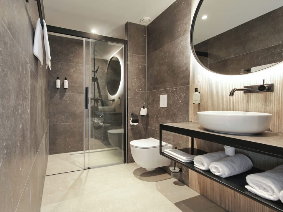 Shower, rainfall showerhead, hair dryer, towels