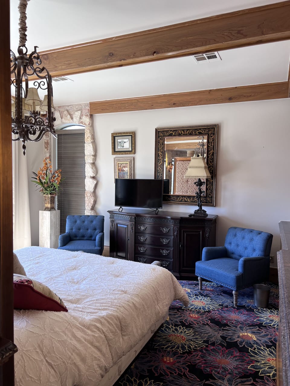 Bedroom seating area and TV in front of the bed