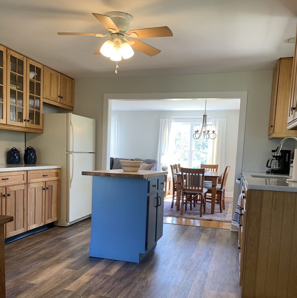 Kitchen with island and connected to dining room