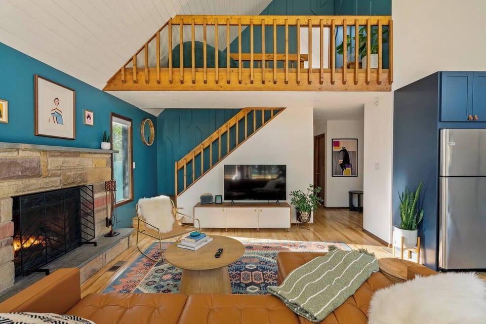 Living Room w/Blue Custom Woodwork Stair Wall