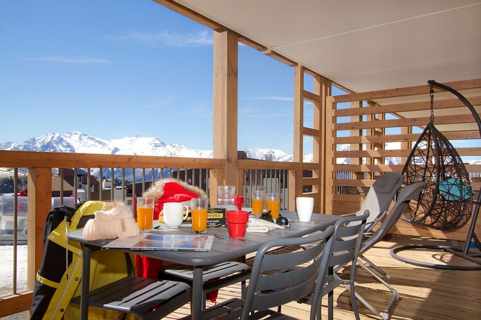 Spacious terrace with panoramic views, offering the ideal spot to enjoy meals and relax under the open sky.