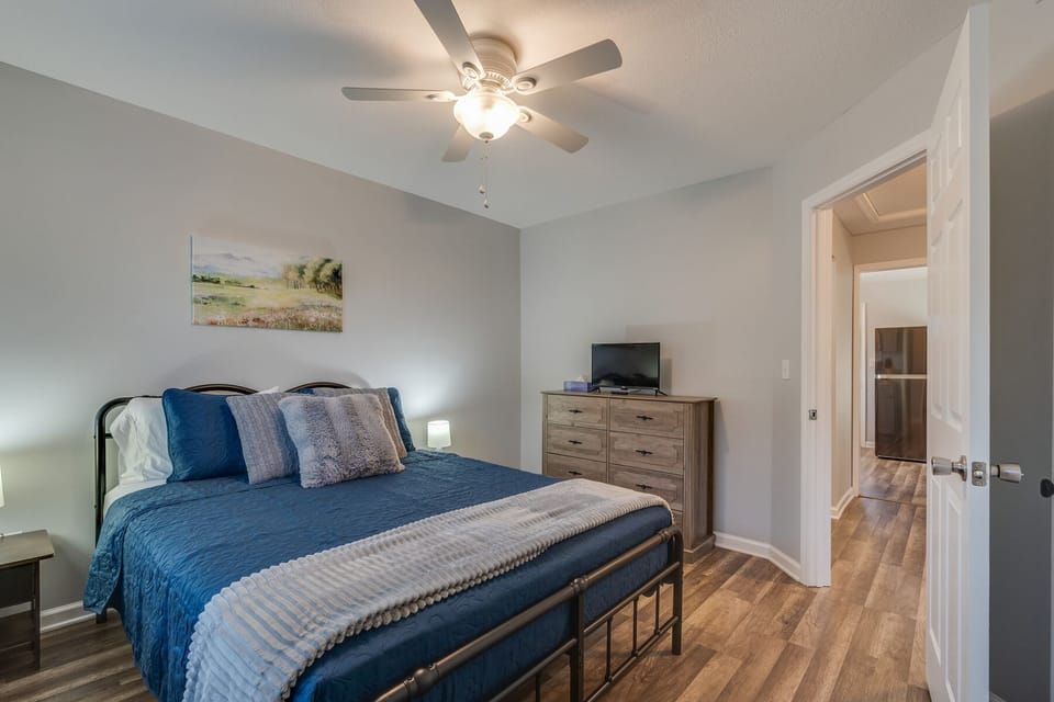 Another view of the Queen bedroom shows the big dresser and TV.