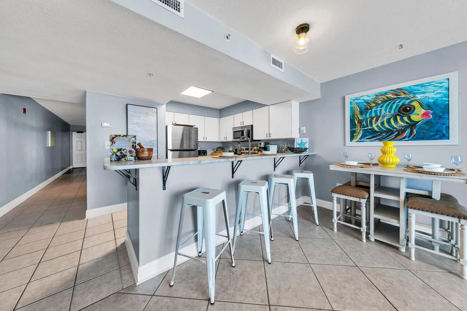 Your spacious kitchen features modern appliances and a breakfast bar, perfect for cooking meals and gathering with family or friends.