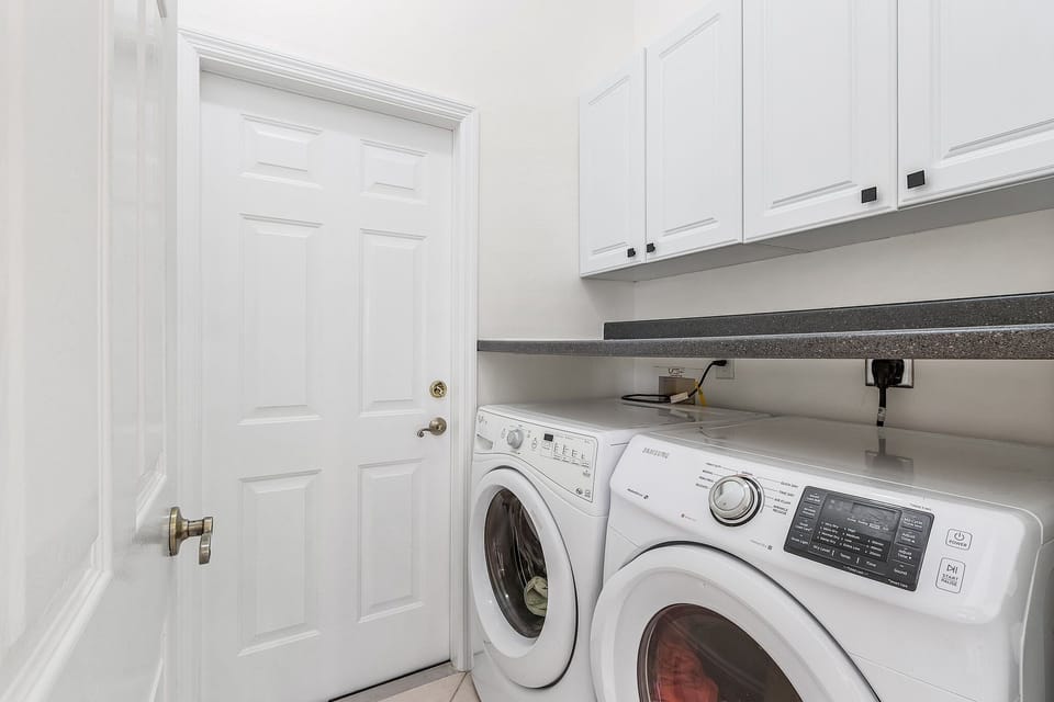 In house laundry with washer and dryer.