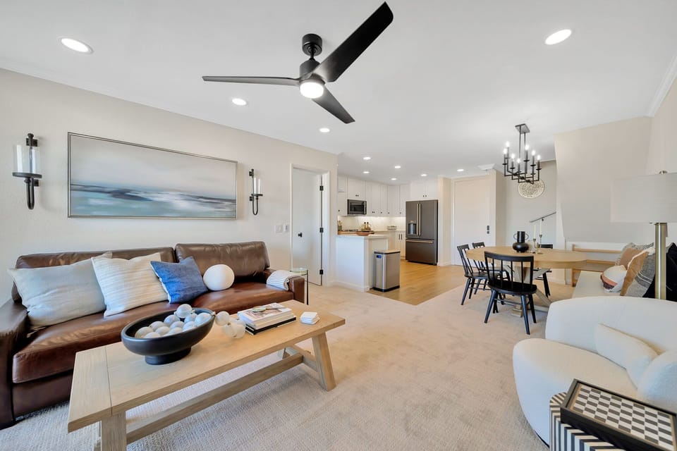 Relax in the living room in either the large comfortable leather sofa or the two swivel accent chairs.