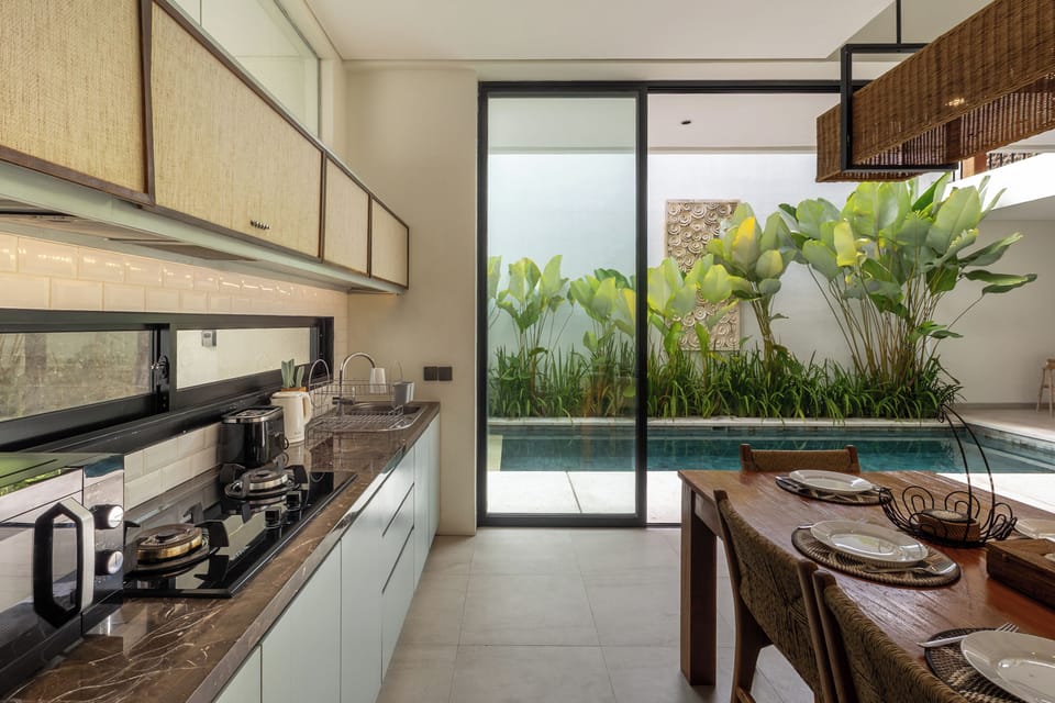 Villa | Private kitchen | Fridge, microwave, toaster, cookware/dishes/utensils