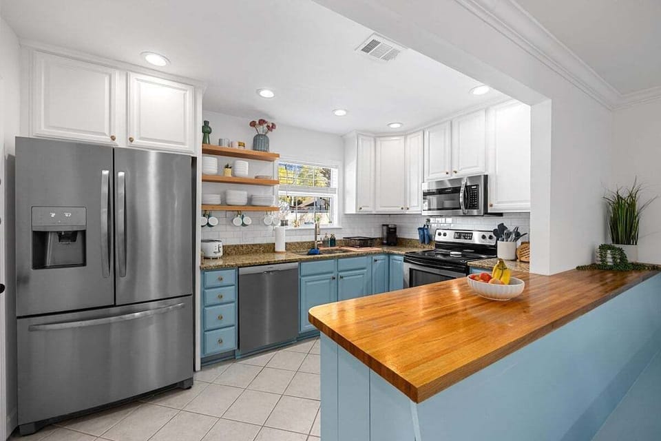 Prepare delicious meals with ease in our contemporary kitchen, equipped with high-quality cooking amenities and plenty of space for culinary creativity.