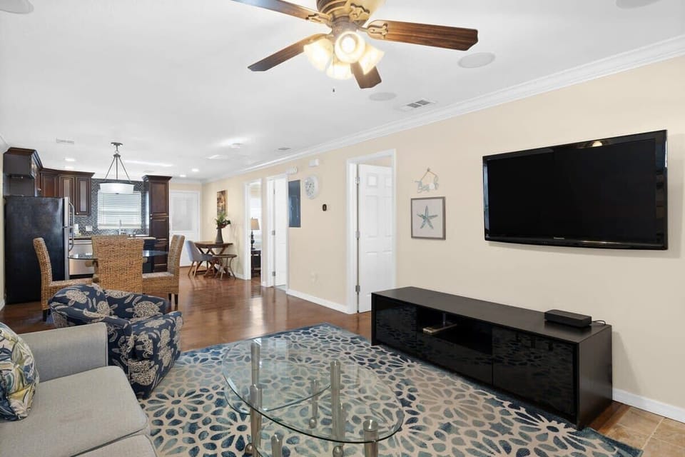 Expansive living room with ample seating and smart TV