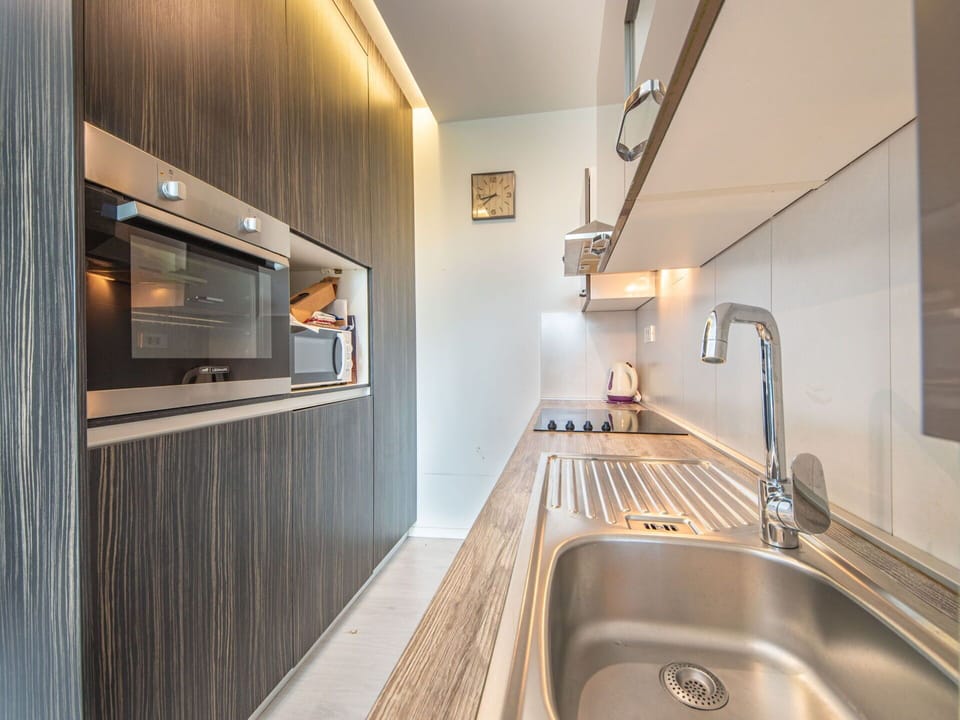Kitchen Sink, Sink, Tap, Countertop, Plumbing Fixture, Cabinetry, Wood, Interior Design, Lighting, Kitchen