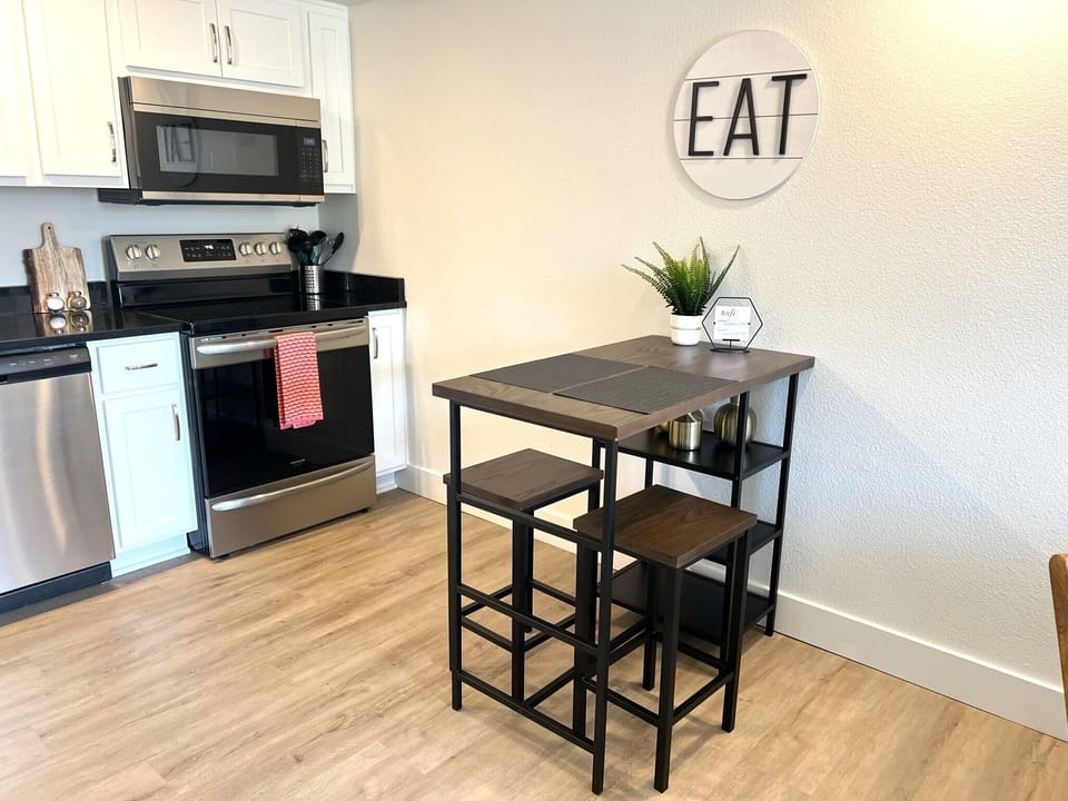 With our spacious kitchen island! The perfect spot to prep meals, enjoy a casual bite, or sip a glass of wine while chatting with friends.