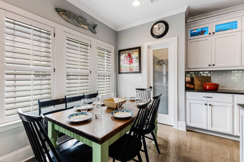 Dine with lots of natural light at this table with 4 chairs & a bench seat on the other side. Behind it is a large, convenient walk-in pantry.