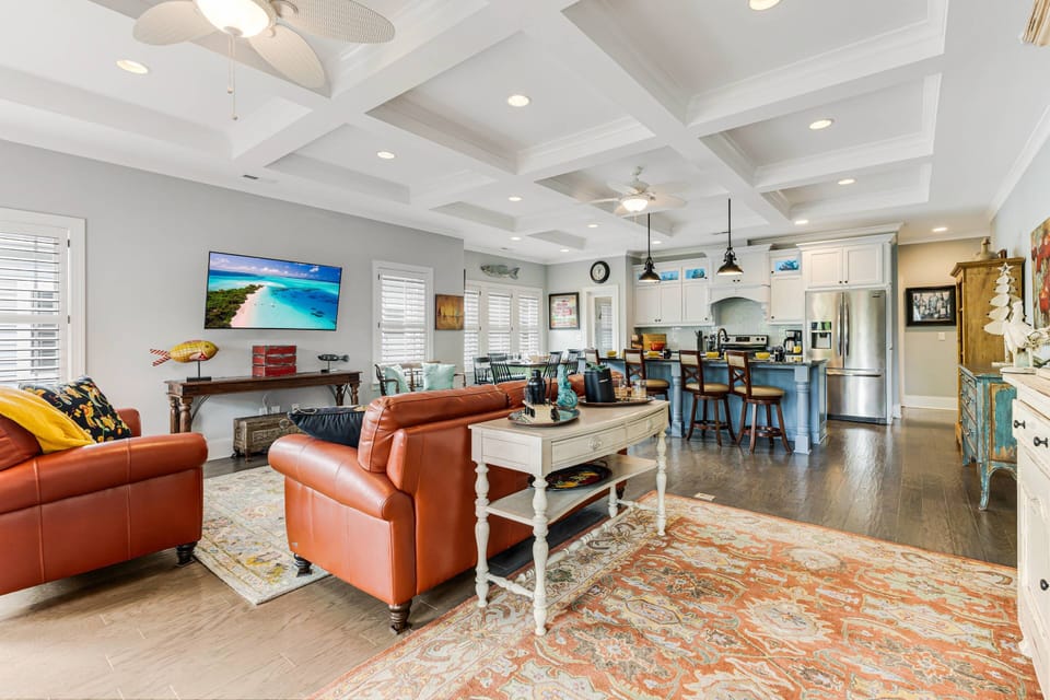 Enter those double glass doors from the porch into the open concept living/dining/kitchen areas.