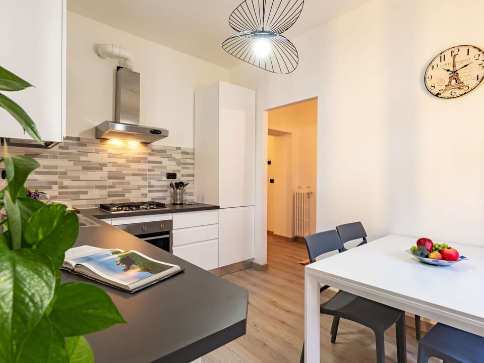 Table, Furniture, Plant, Houseplant, Wood, Cabinetry, Lighting, Interior Design, Architecture, Clock