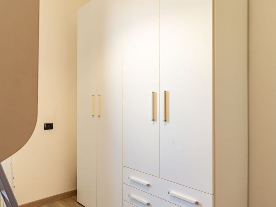 Cabinetry, Wood, Hardwood, Wardrobe, Flooring, Wood Stain, Room, Gas, Plywood