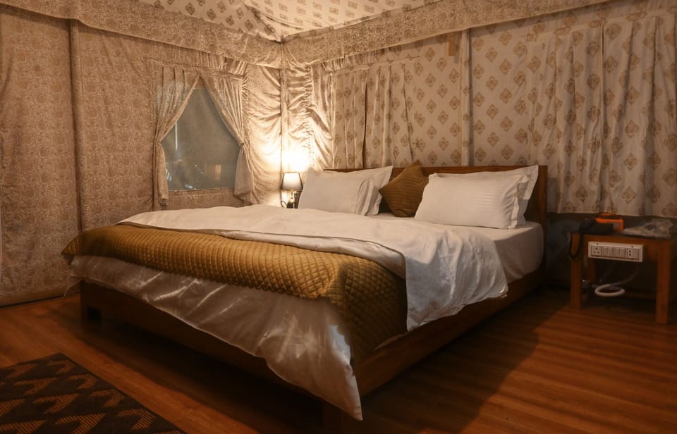 Deluxe Tent | Premium bedding, down comforters, memory foam beds, desk