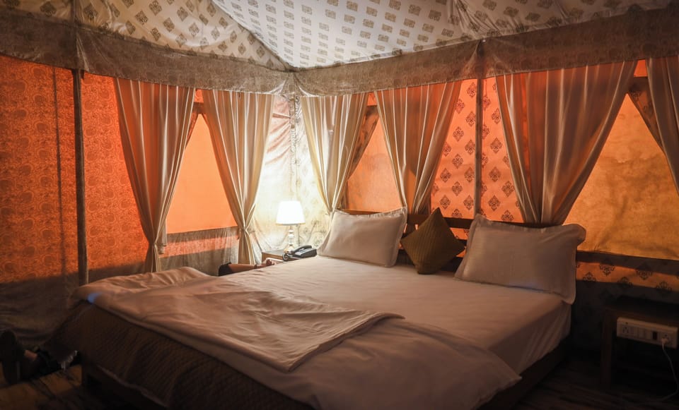 Deluxe Tent | Premium bedding, down comforters, memory foam beds, desk