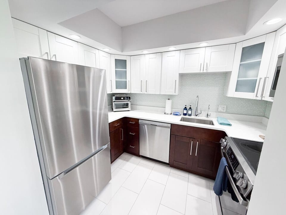 Kitchen with filtered water tap to the right of the kitchen sink, also the freezer has a filtered water ice maker