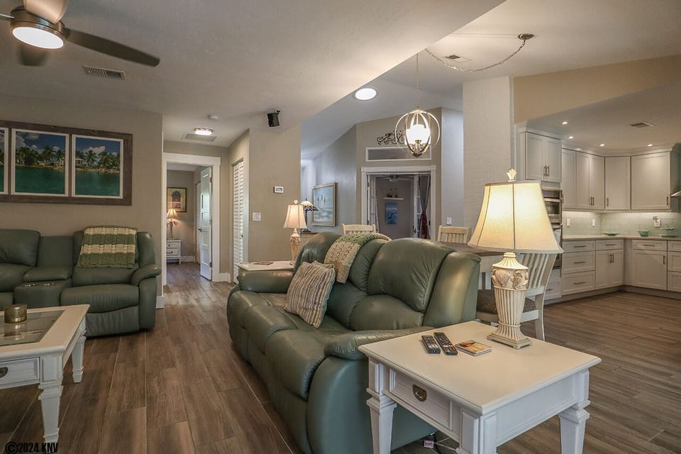 The entire space has undergone a meticulous remodel, showcasing pristine new flooring and furniture.