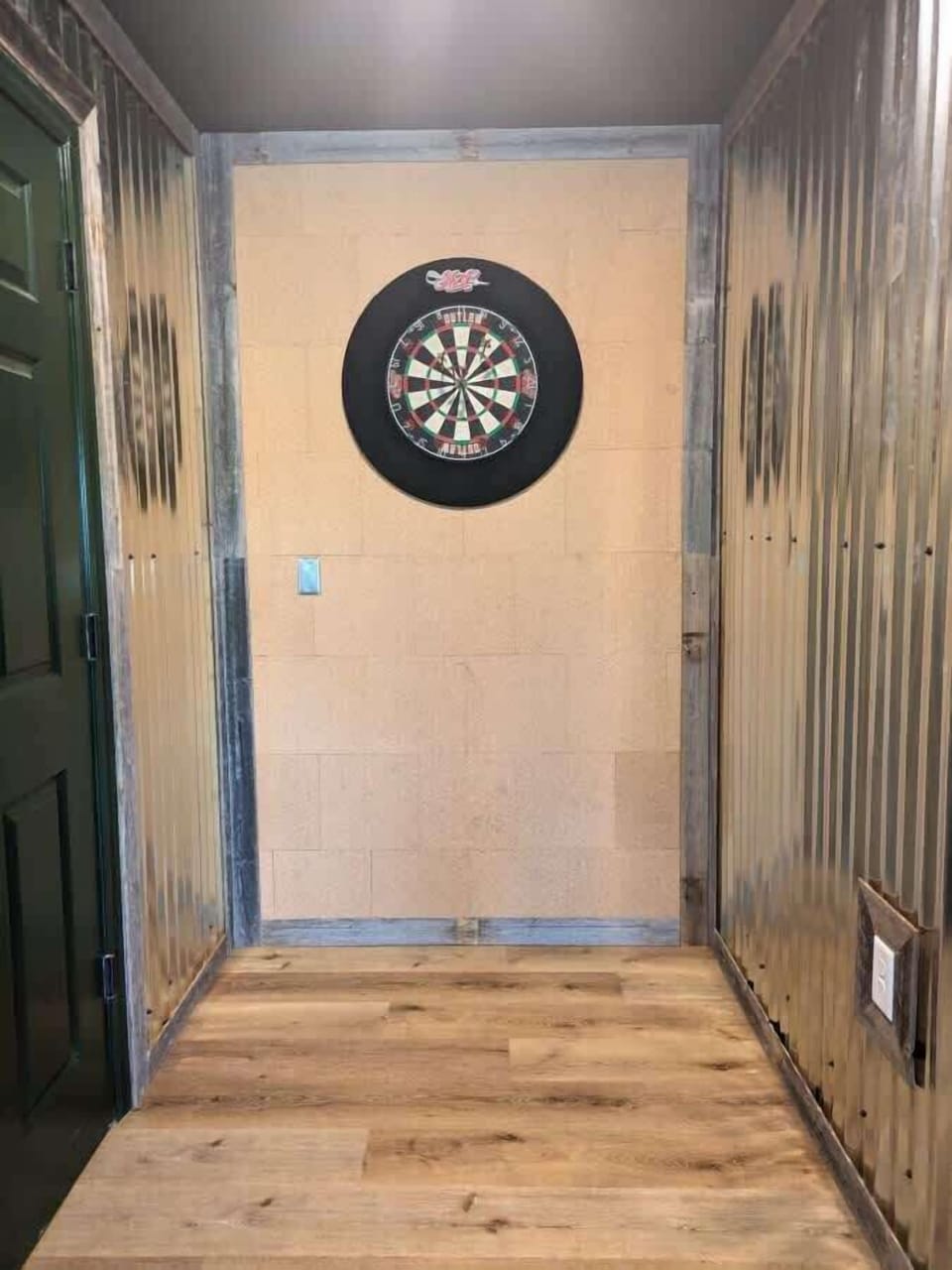 The regulation dart board alley is right off the bar