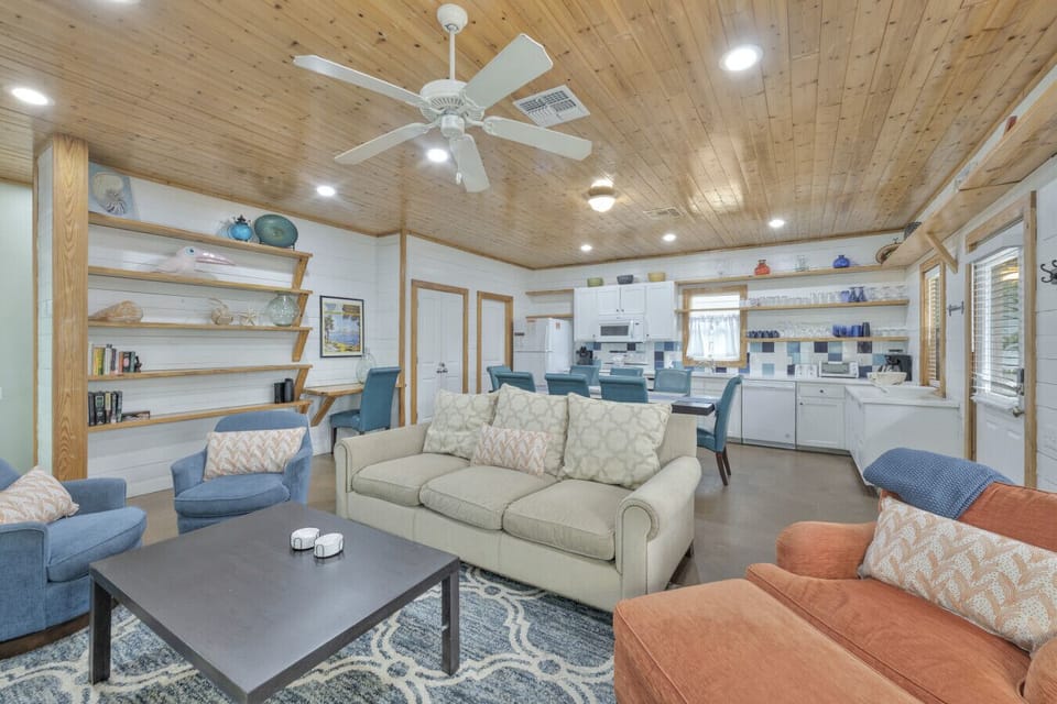 Bright, open-concept living area with coastal décor