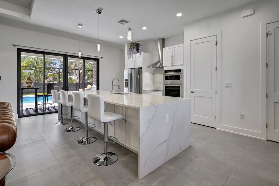 Our kitchen has direct access to the pool; the laundry room is behind the second door