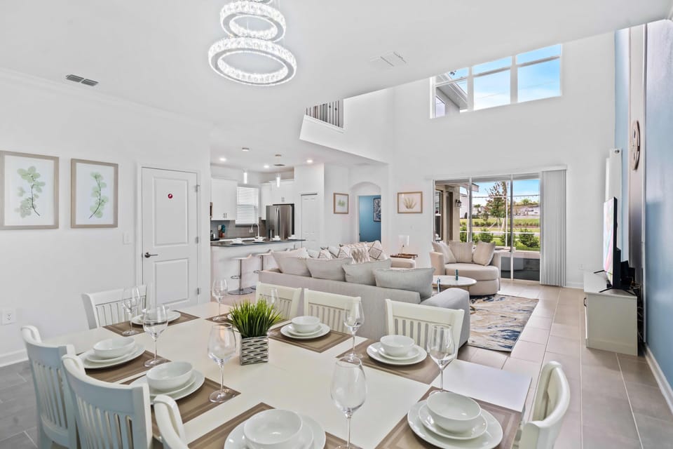 Beautiful Dining area of the Apartment in Kissimmee Florida - 8 Persons Dining - Elegant chandelier - Open-concept living area seamlessly connected to a stylish living area