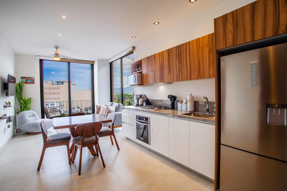 The well-appointed kitchen includes a full-size fridge, stove, oven and microwave