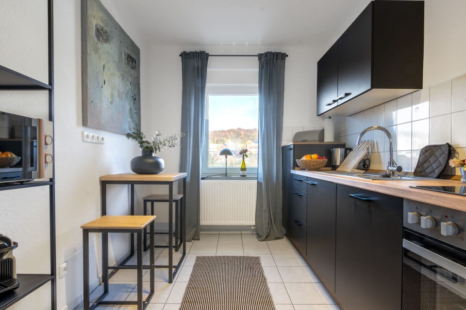 Family Apartment, 2 Bedrooms | Private kitchen | Fridge, microwave, stovetop, electric kettle