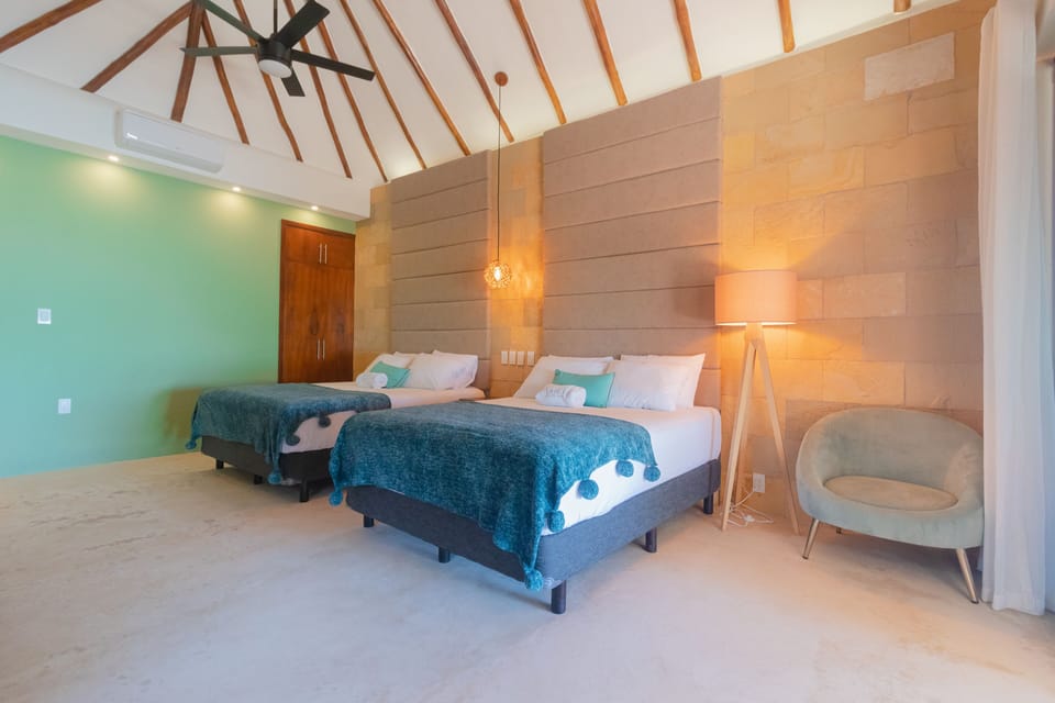 Deluxe Cabin, 2 Queen Beds, Lagoon View | 1 bedroom, down comforters, desk, laptop workspace