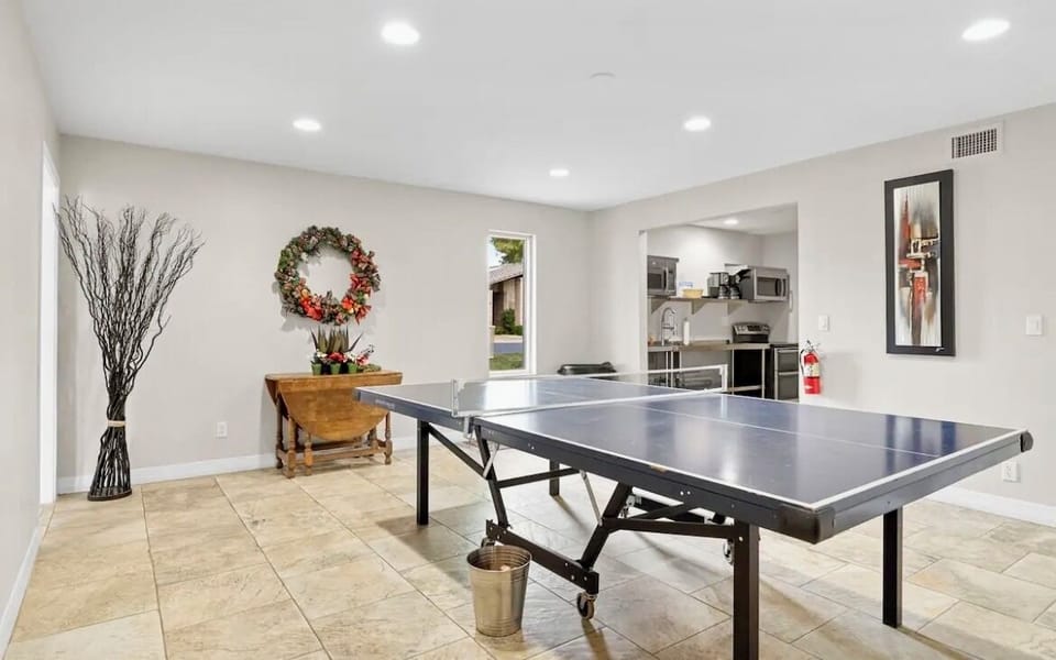 Ping pong table located in the clubhouse right around the corner from house.