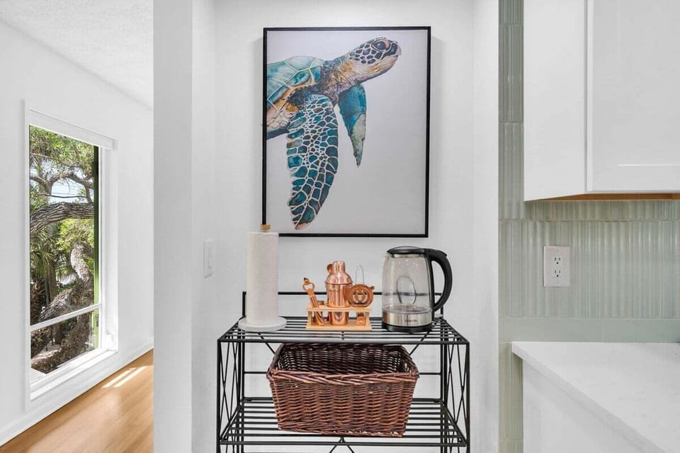 Open shelves and barware for crafting your favorite cocktails—this kitchen is as stylish as it is functional.