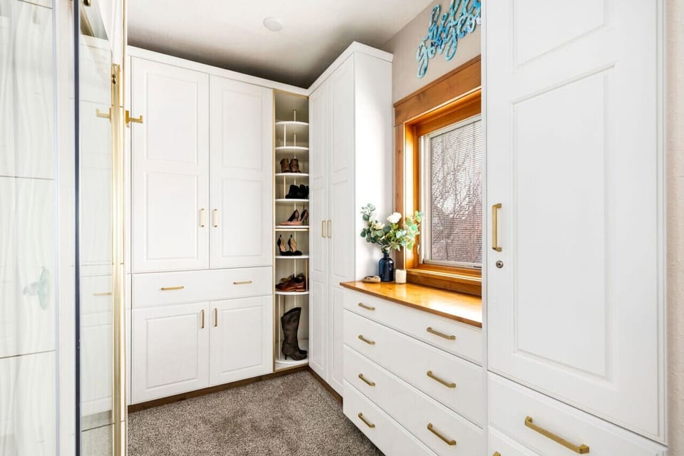 Master Closet with a View: Custom Built-Ins, Shoe Carousel & Stunning City Vistas