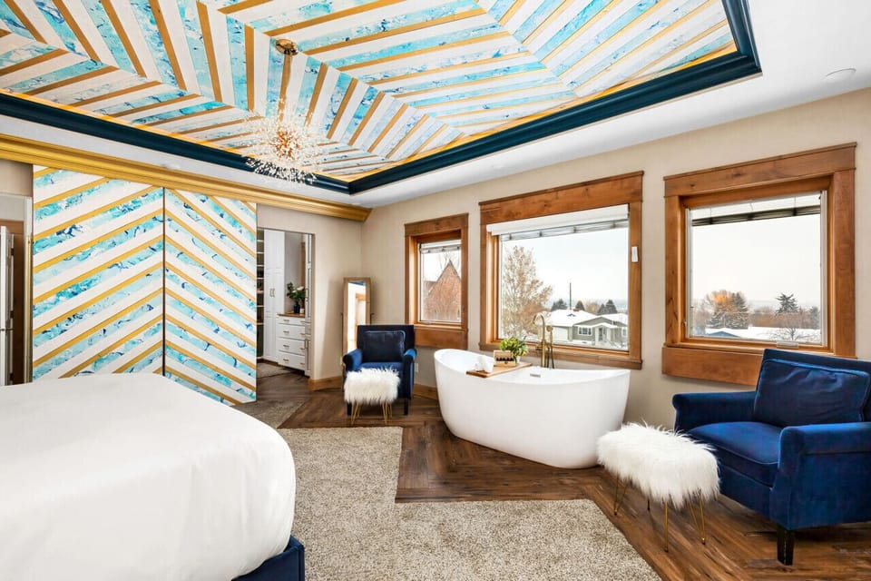 Master Suite Luxury: Jetted Freestanding Tub with City Views & Remote-Controlled Shades