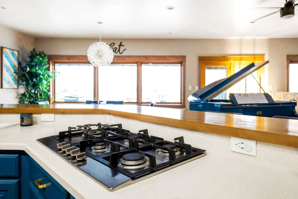 Designer Kitchen Remodel by Wrecked & Refined - Modern Lighting & Backsplash with City Views