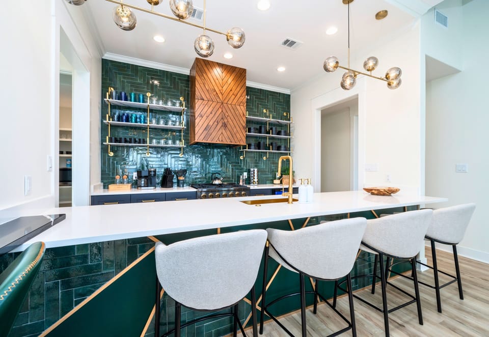 Gathering around the oversized island is easy here, with plenty of seating for meals, snacks, and catching up with family and friends.