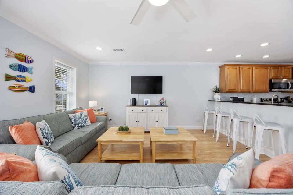 Another view of the living area, open to the kitchen and complete with a Smart TV where you can stream to your heart's content.